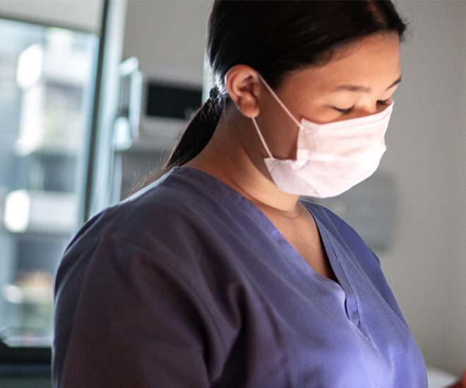 A female doctor in scrubs