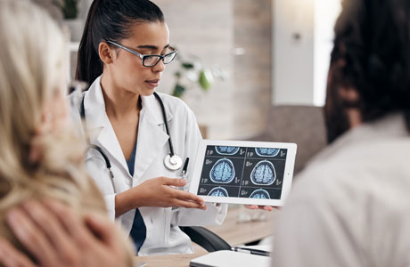 A medical professional displaying an image