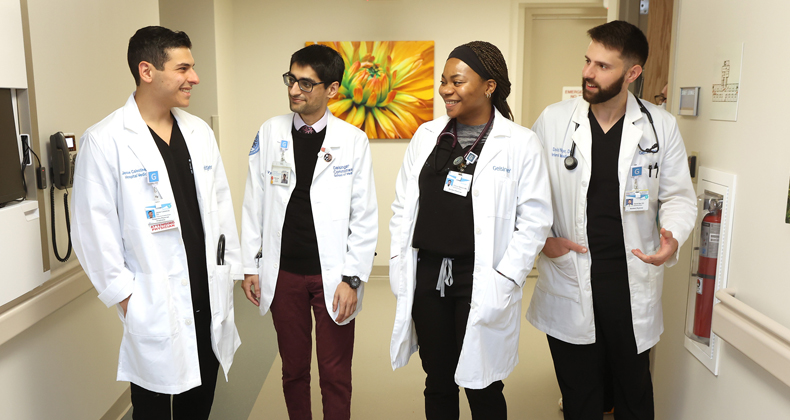 Students chatting in a hospital hallway