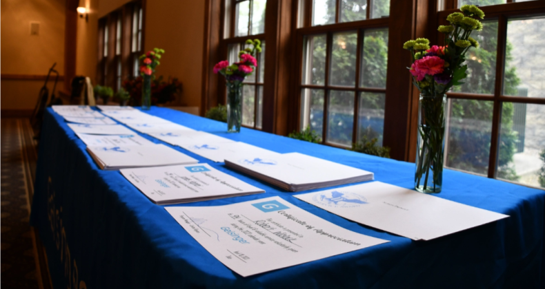 Table with name cards for a celebration of Geisinger volunteers