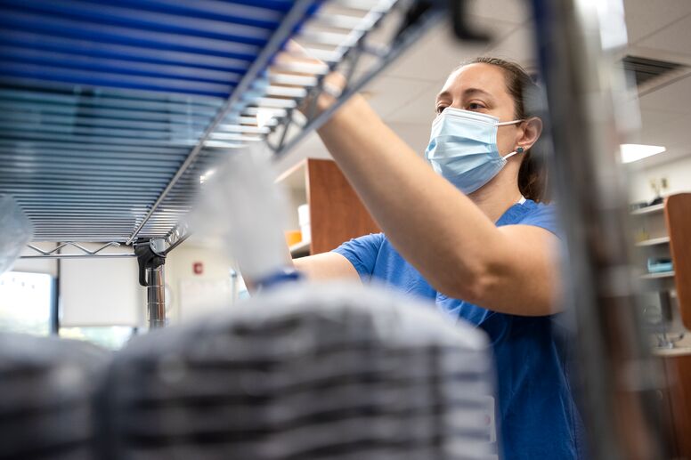pharmacist at a shelf